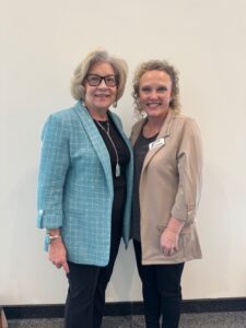 Amy Schaefer, CEDA’s Rural Capacity Program Manager, poses with Senator Carla Nelson during a trip to the Capitol to speak about the program.